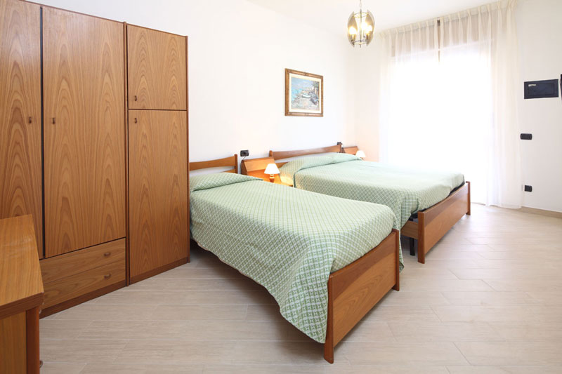 Two room apartment with master bedroom, single bed and terrace